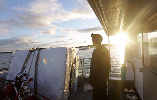 Person watching the sunset on a boat