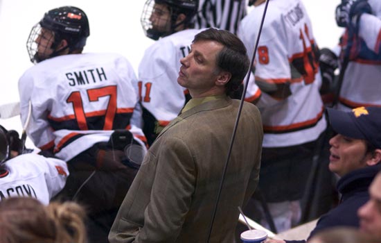 Coach with RIT hockey players