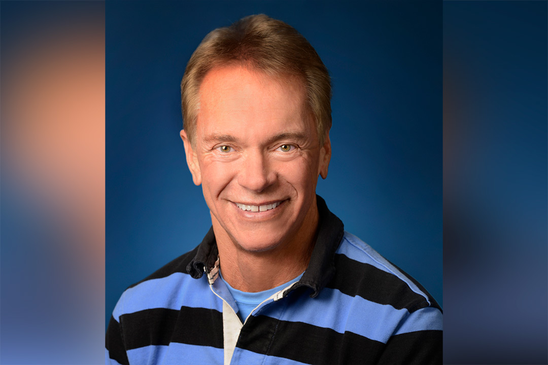 Head-and-shoulders view of man wearing striped polo shirt