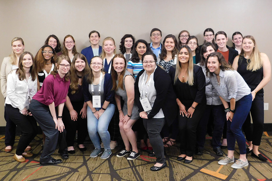 A group of women pose for a photo at the Grace Hopper Celebration.