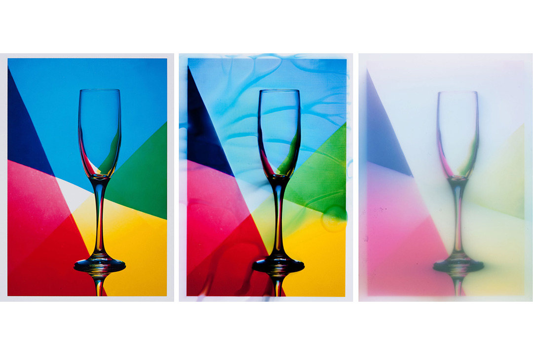 The three research test sample images are side by side. The photo is of a clear champagne glass with a geometric, rainbow background. The image on the left is very clear, the image in the middle is fairly clear but slightly distorted, and the image on the right is very faded and blurry.