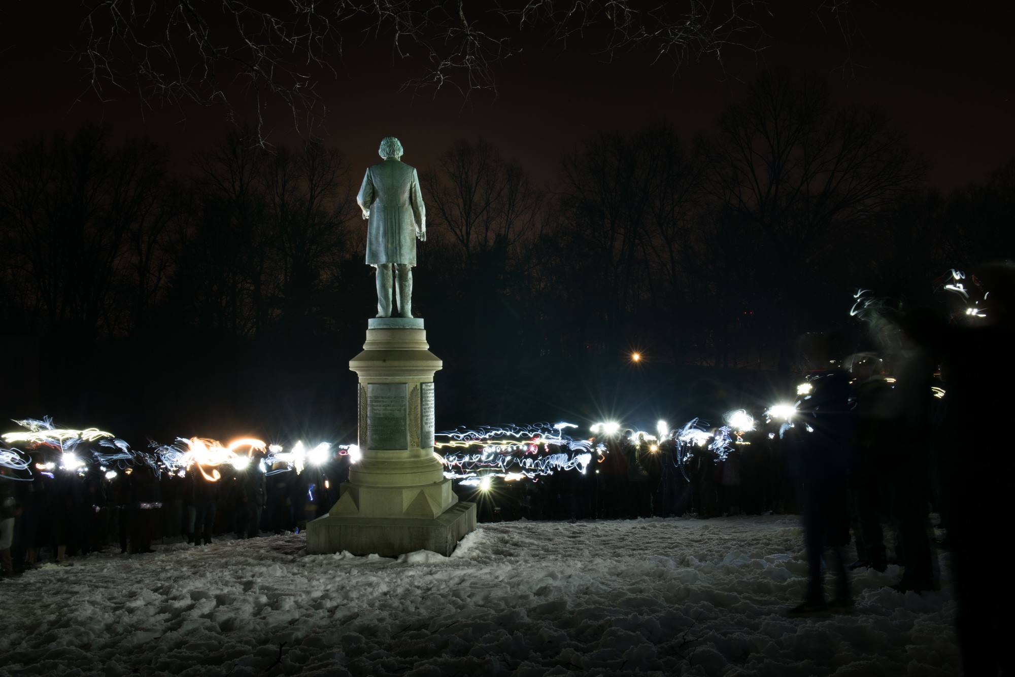 Using flashlights people "painted with light" to create a nighttime photo of Frederick Douglass statue.