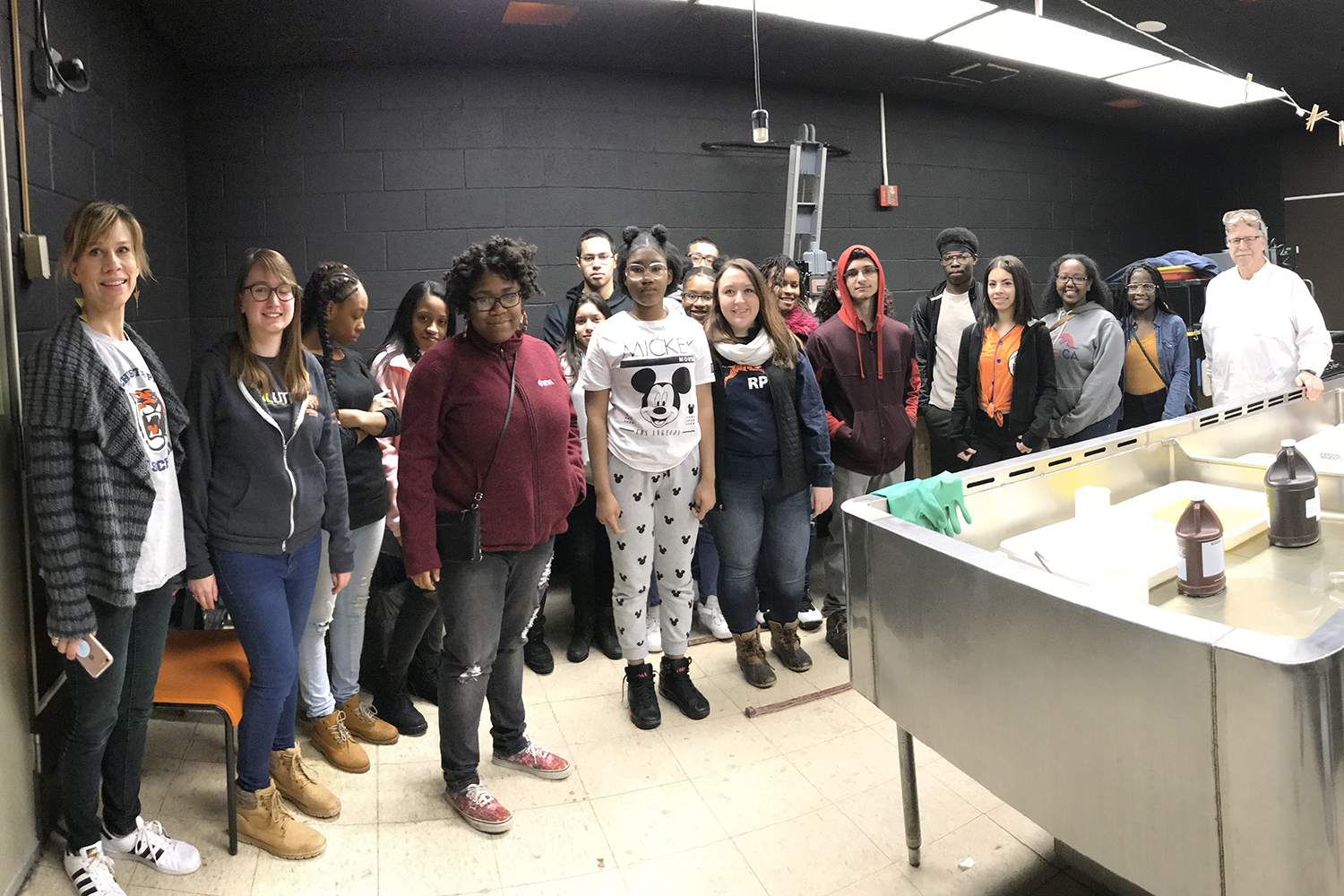 A group of local high school students learn about darkroom processes at RIT.