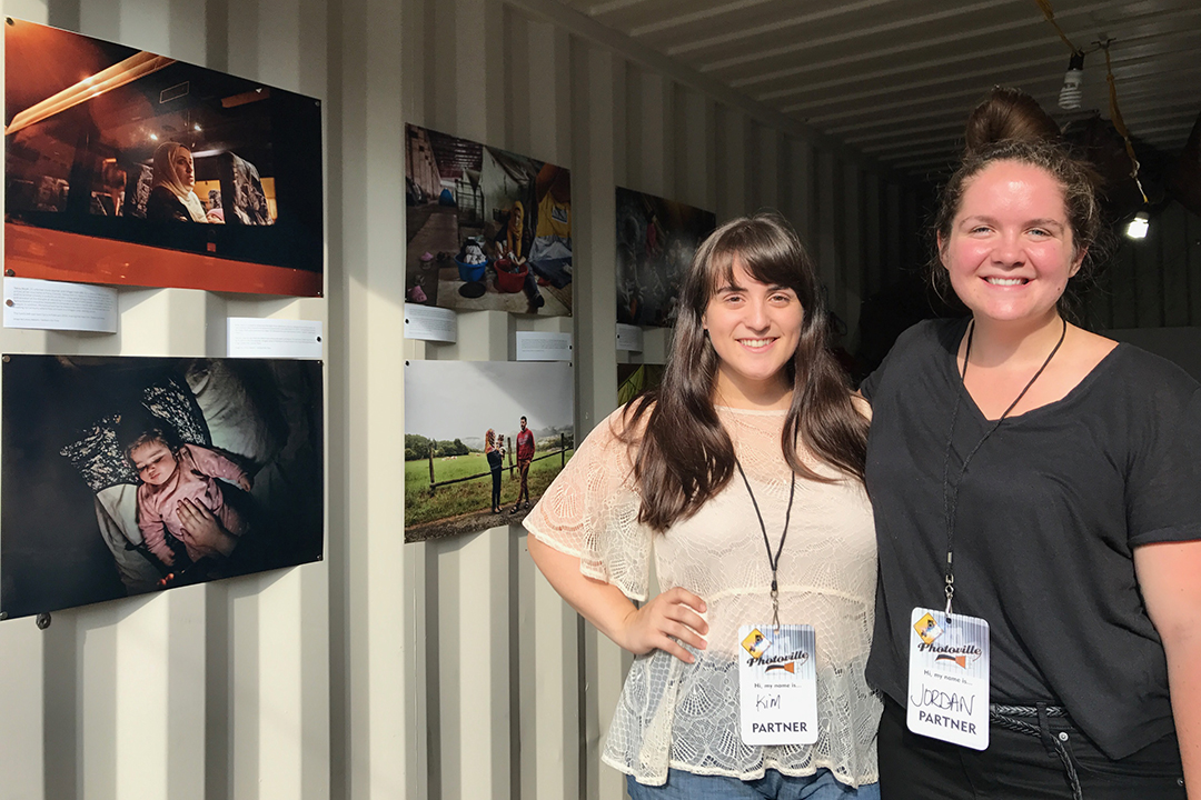 Kim Bubello, left, and Jordan Roth worked together on the installation of the "Finding Home" exhibit at Photoville in Brooklyn.