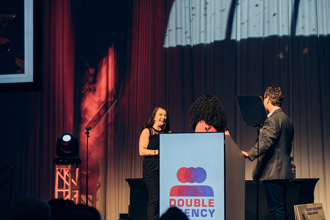 A student accepts an award.