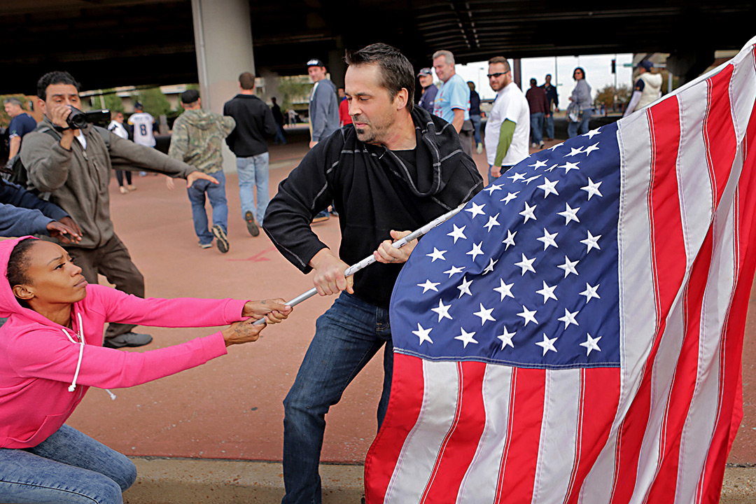 Man tried to pull American flag away from female protestor