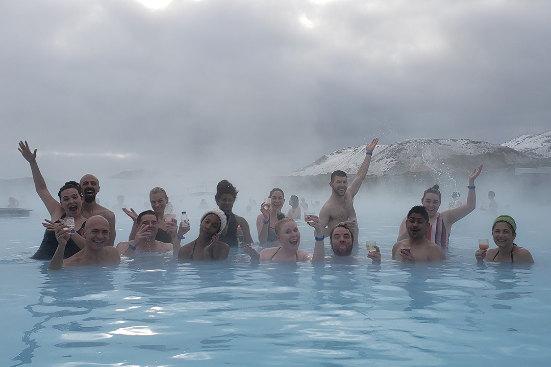 Group of people in lagoon.