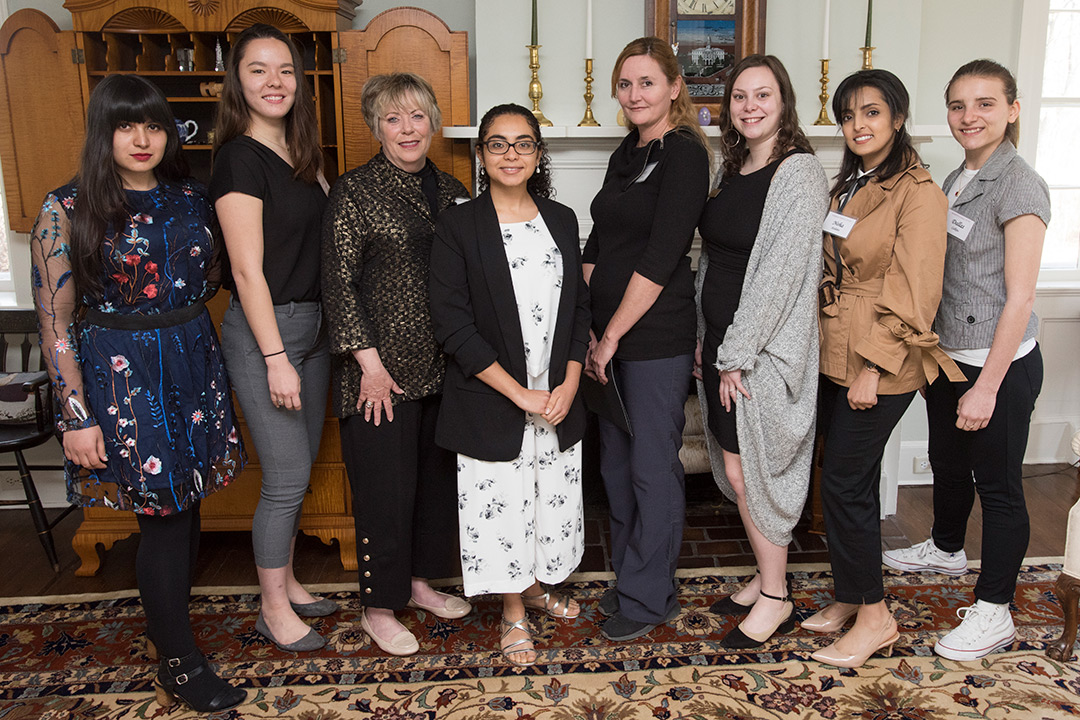 Group of eight women poses.