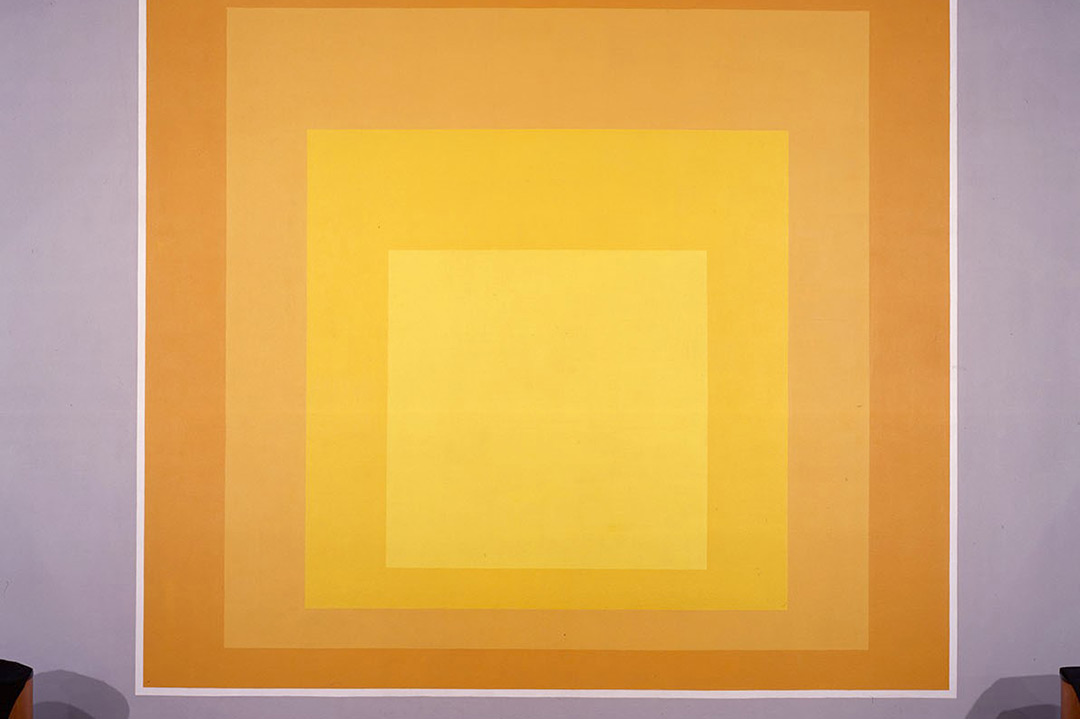 Mural of concentric yellow and orange squares.