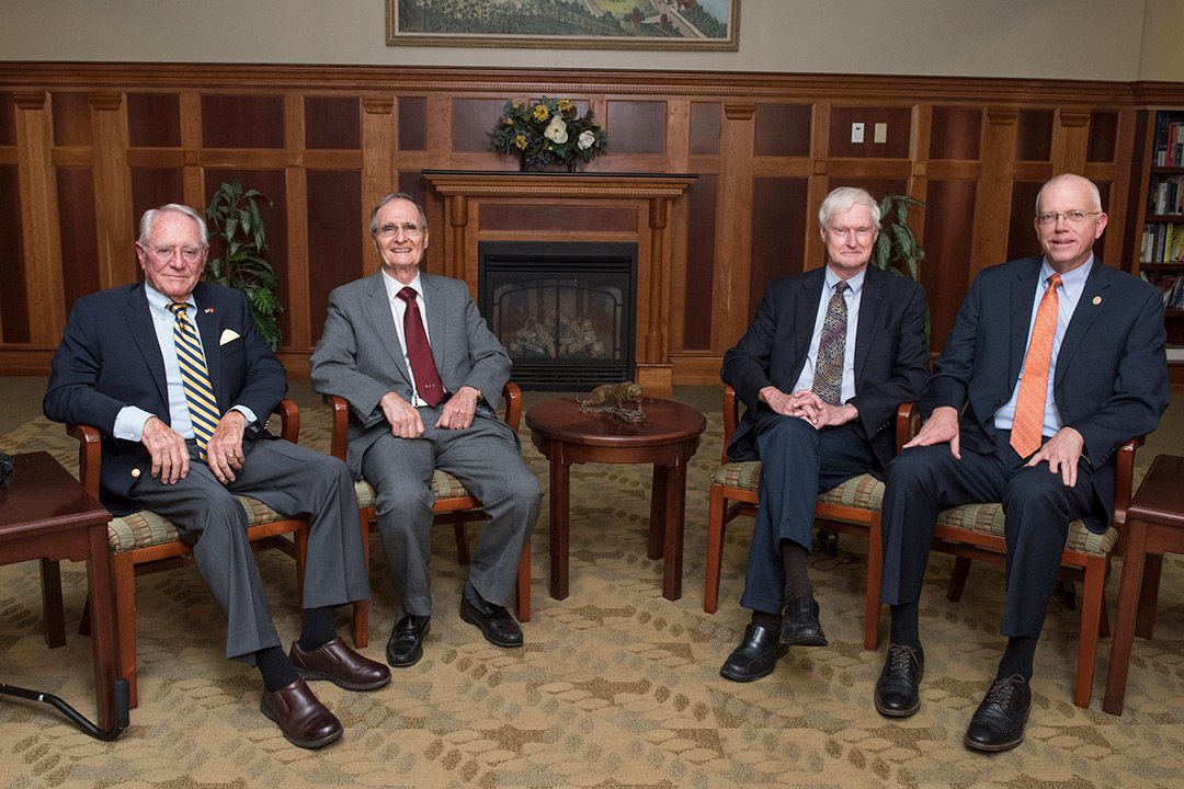 Four RIT presidents sit in chairs.