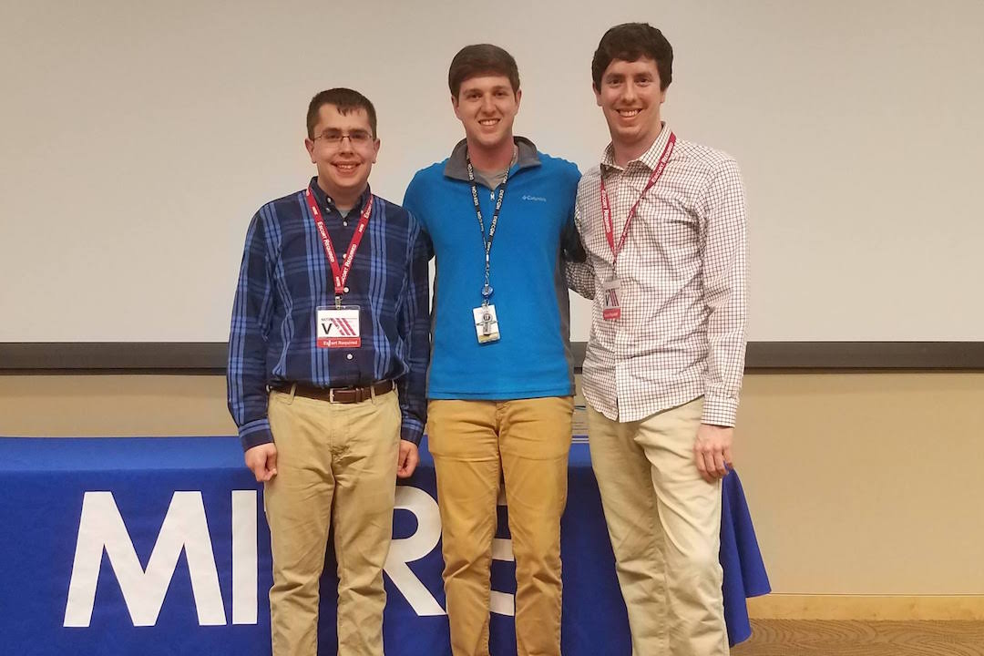 Three students standing 