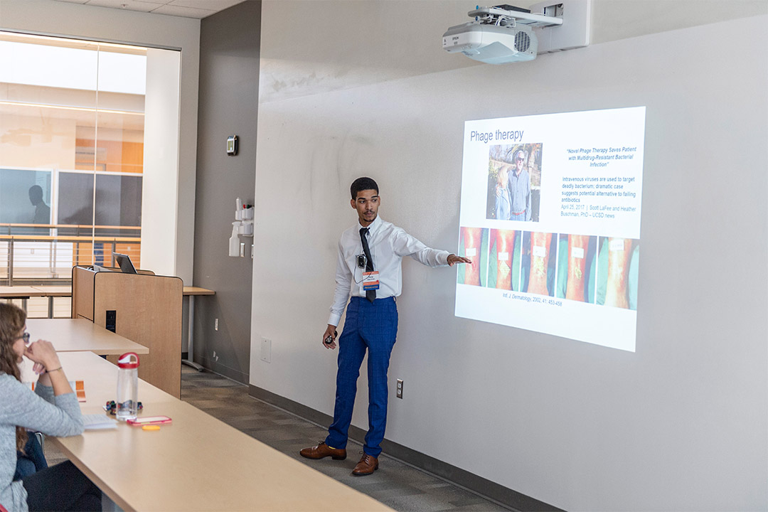 Student gives presentation on phage therapy.