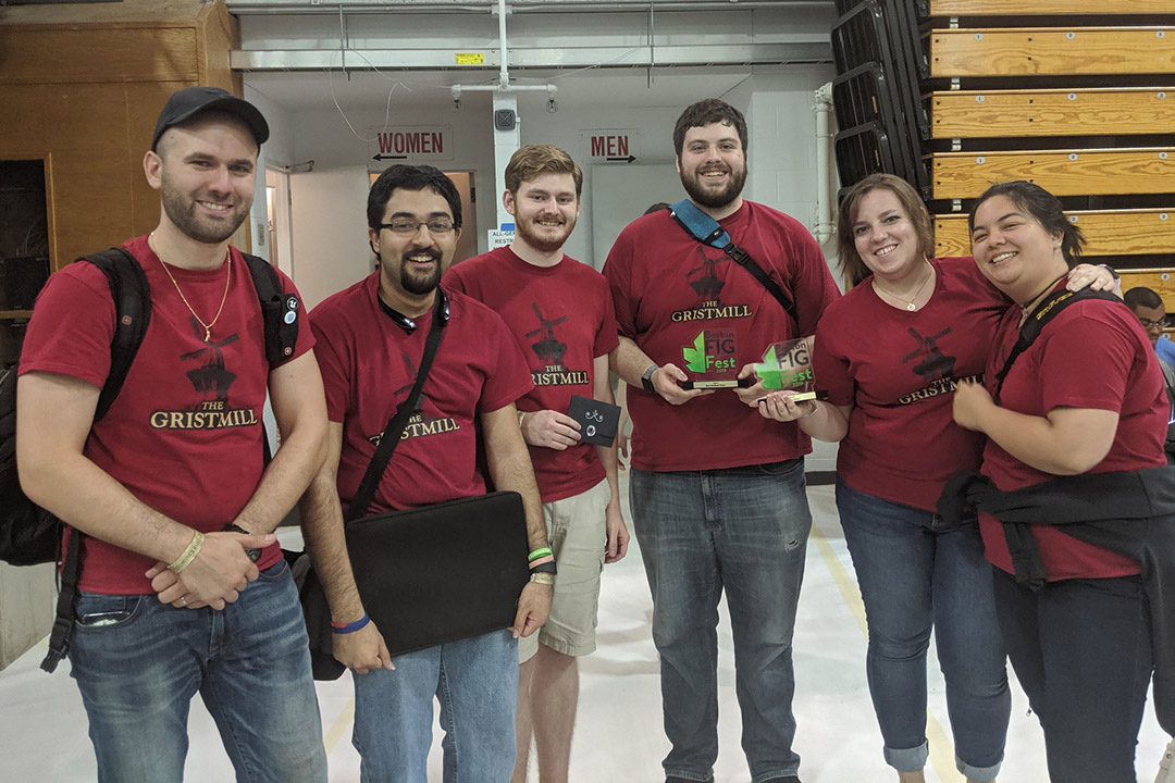 Team of six students wearing red T-shirts that read "The Gristmill."