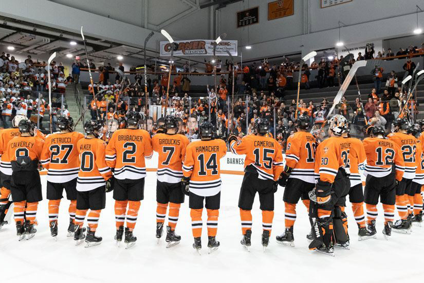 Hockey team lines up on the ice.