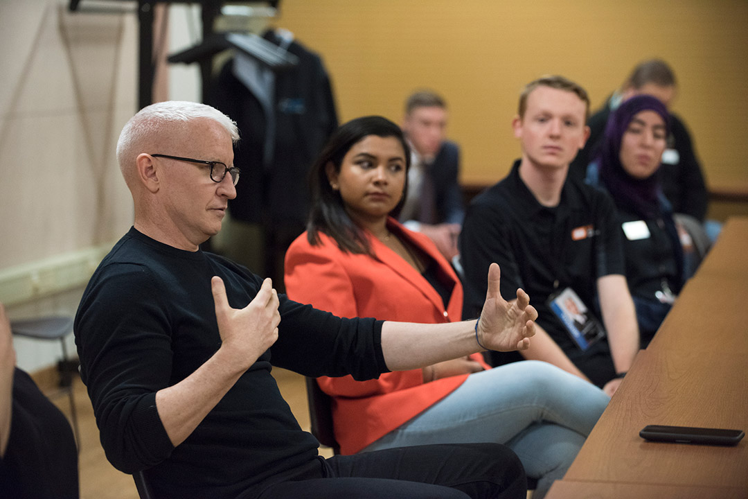 Anderson Cooper talks with students.