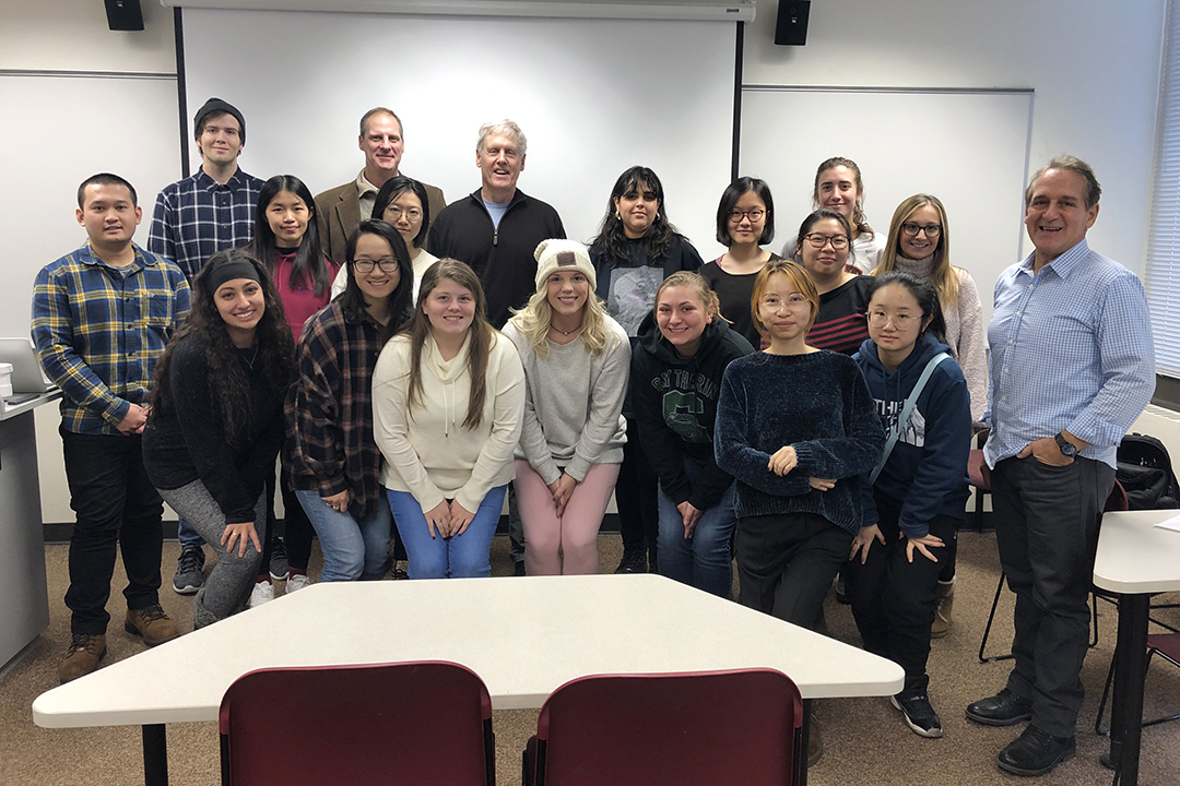 Students, faculty and Dean Todd Jokl pose for a photo with Steve Sasson