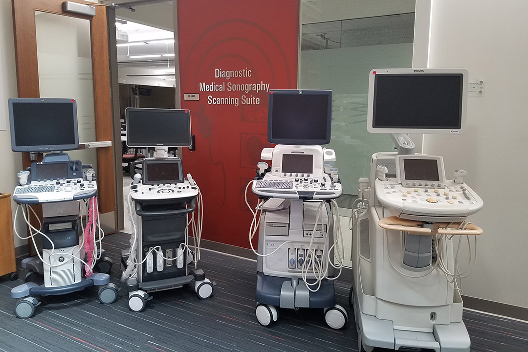 Four mobile ultrasound machines.