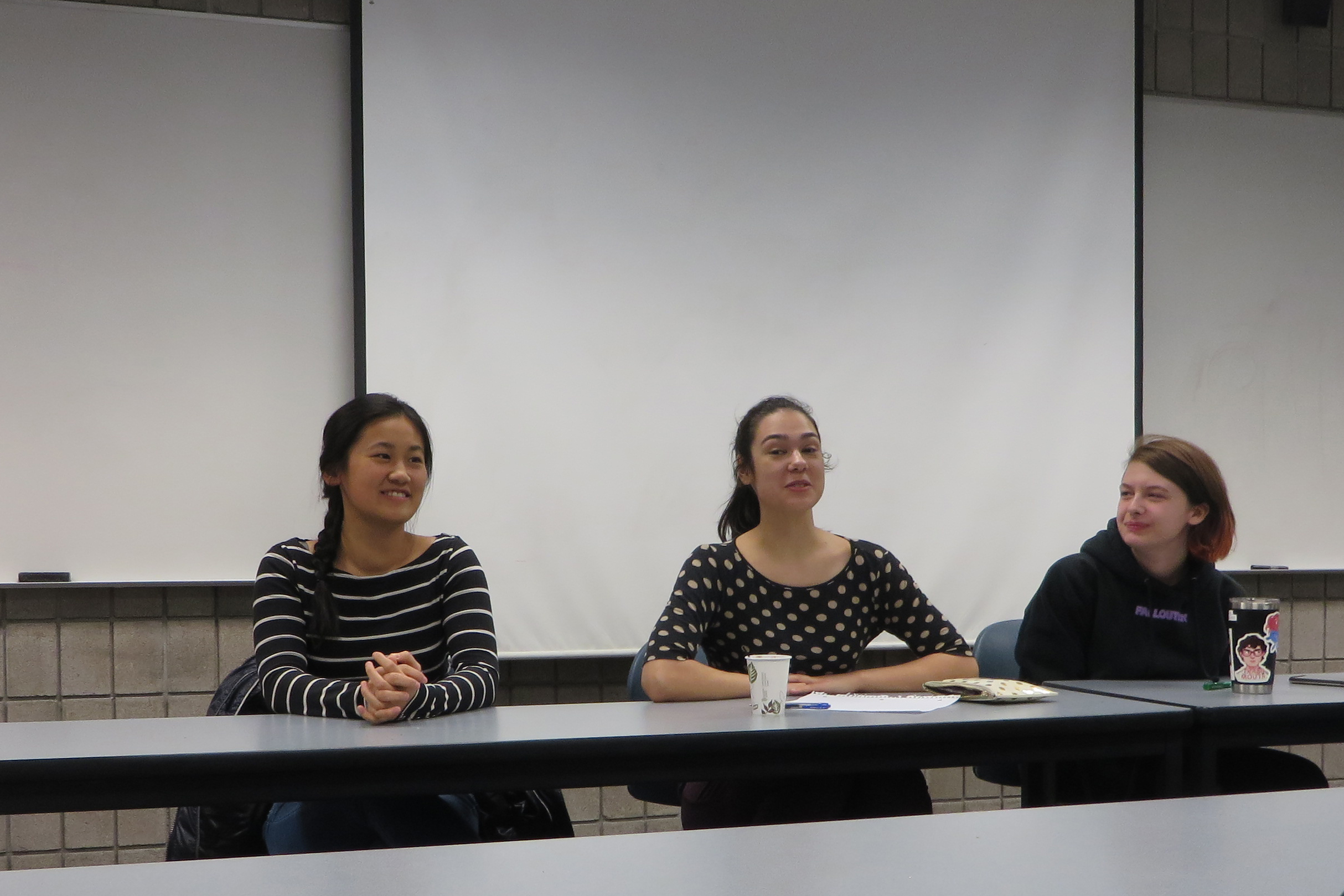 panel of three female students sitting at a table