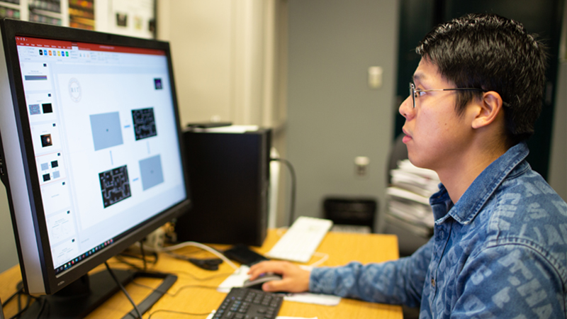 student working at computer monitor