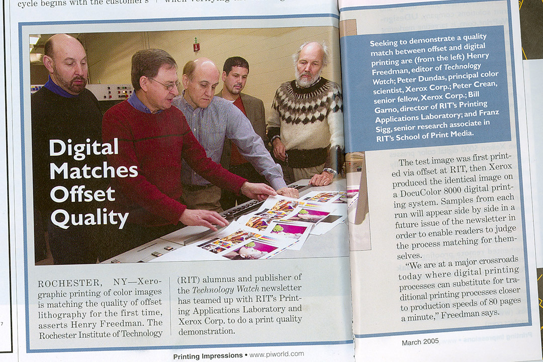 magazine story featuring scientists comparing print copies of color images.