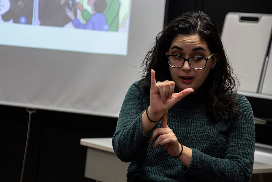 woman using American Sign Language.