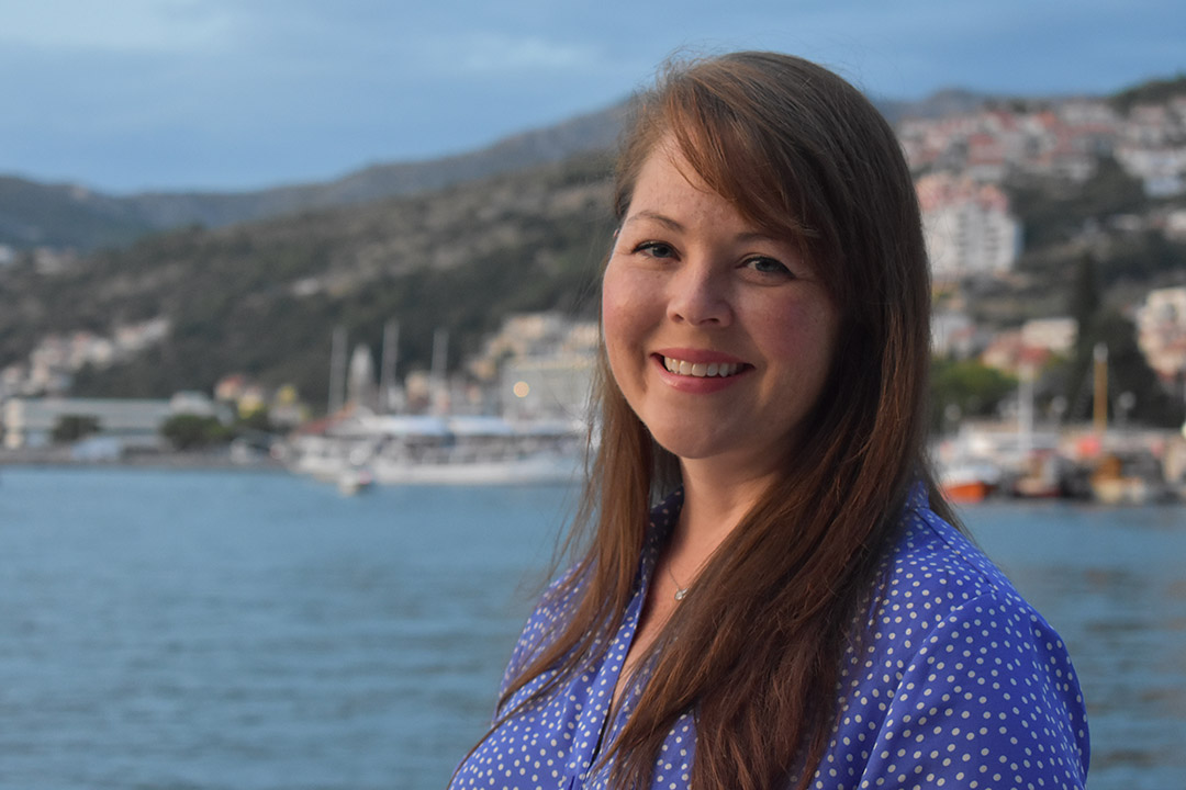 researcher posing on coast of Adriatic Sea in Croatia.