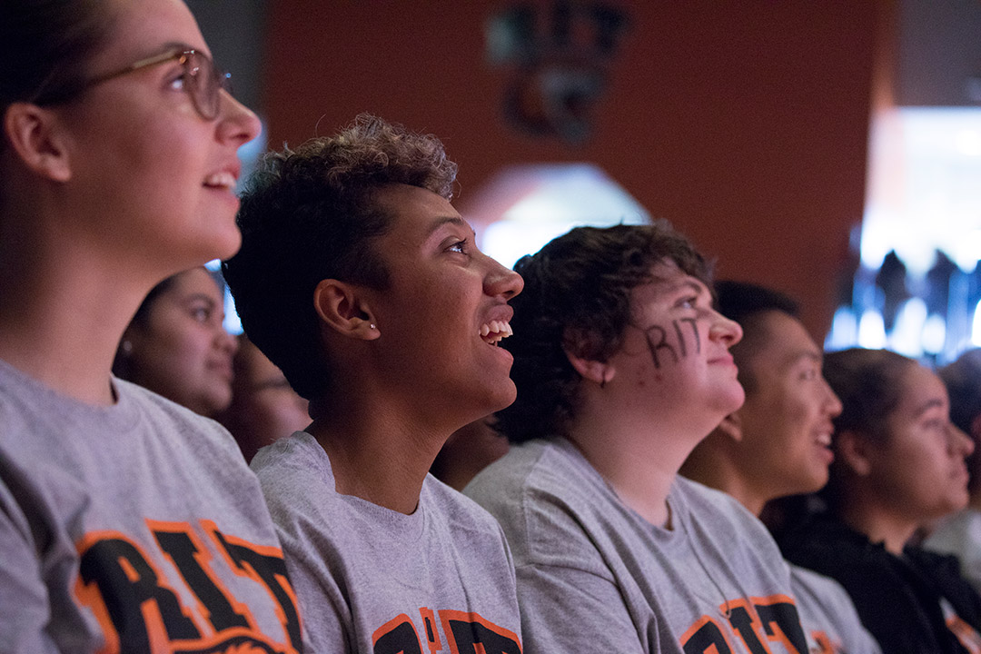 row of RIT students wearing gray RIT T-shirts.
