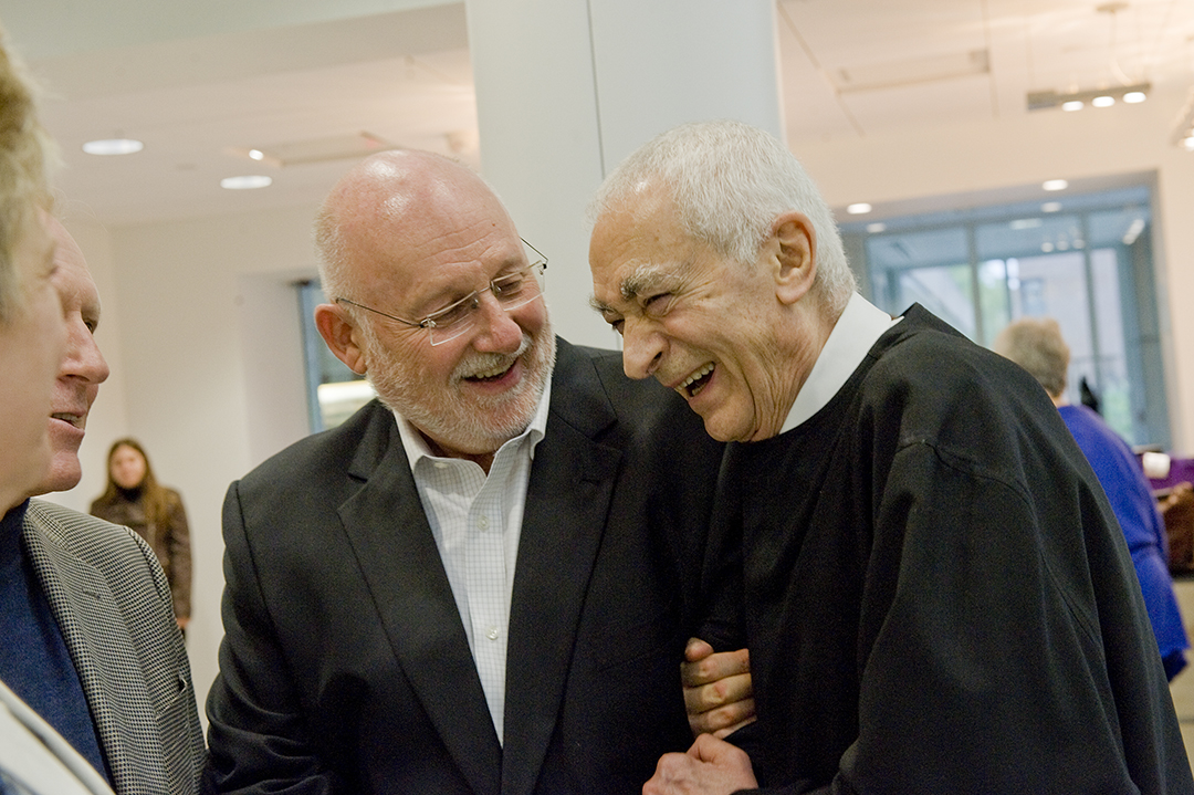 R. Roger Remington and Massimo Vignelli embrace at the dedication of RIT's Vignelli Center for Design Studies.