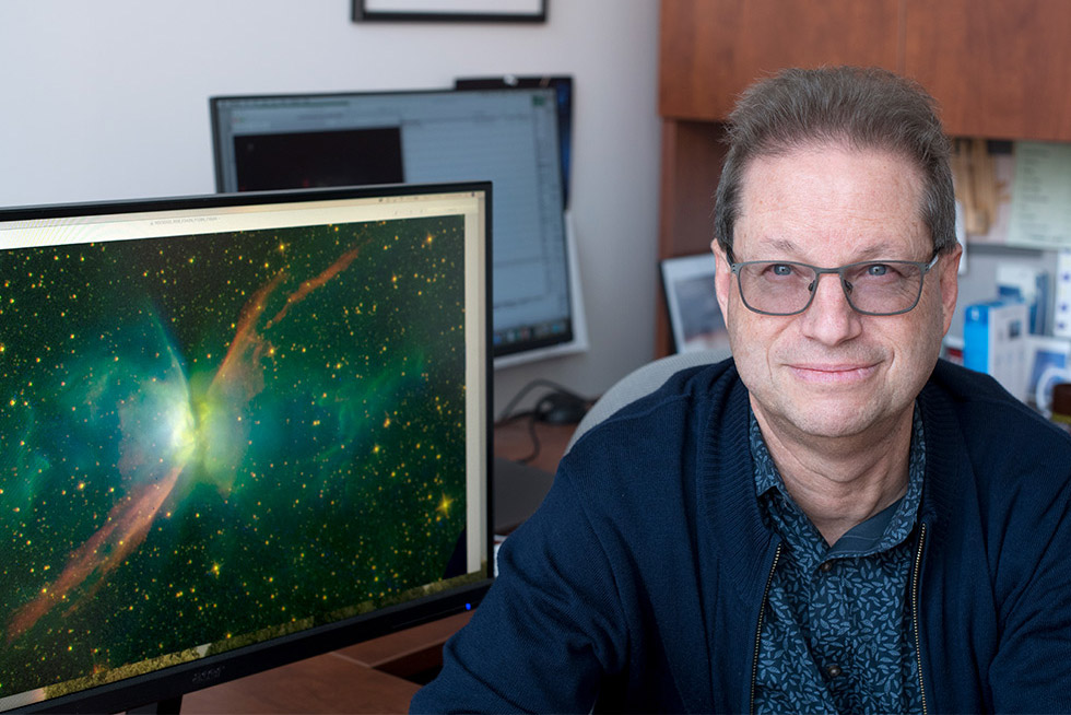 reseacher with view of space on computer screen.