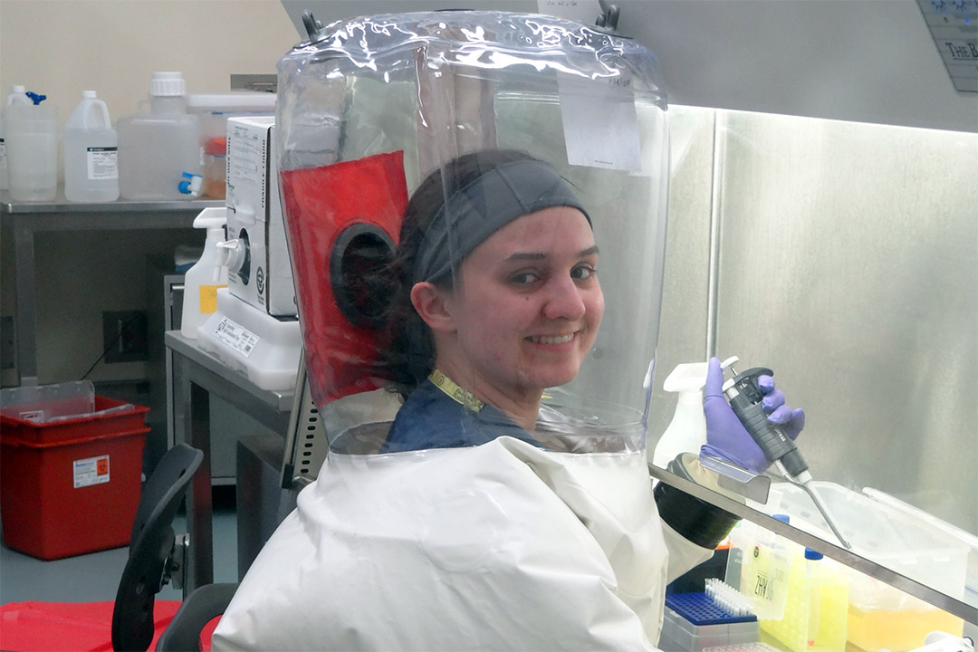 researcher working in clean suit.