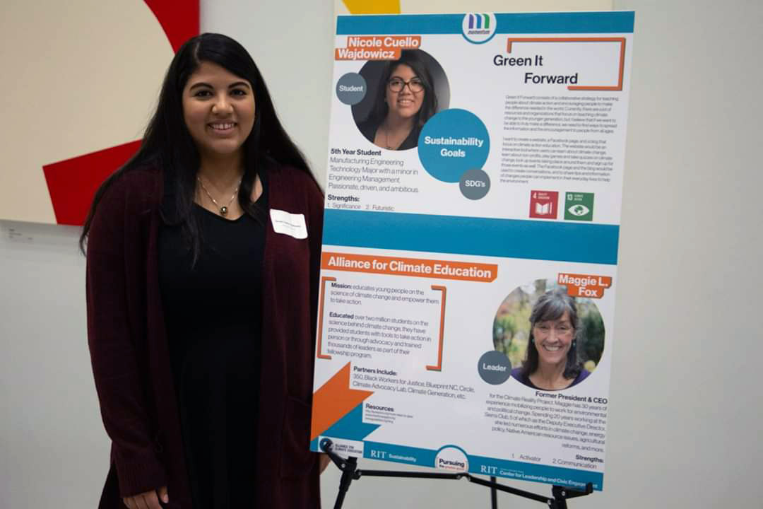 student standing with poster presentation.