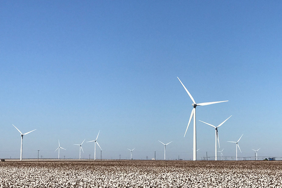 wind turbines on a commerical building roof.