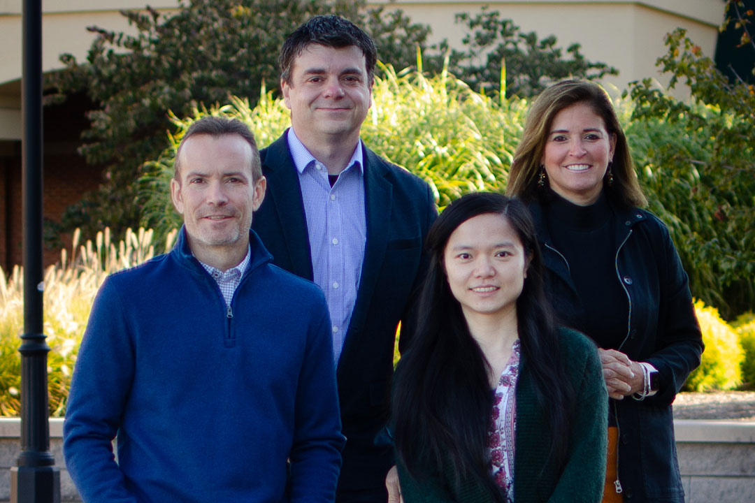 four researchers posing for photo.