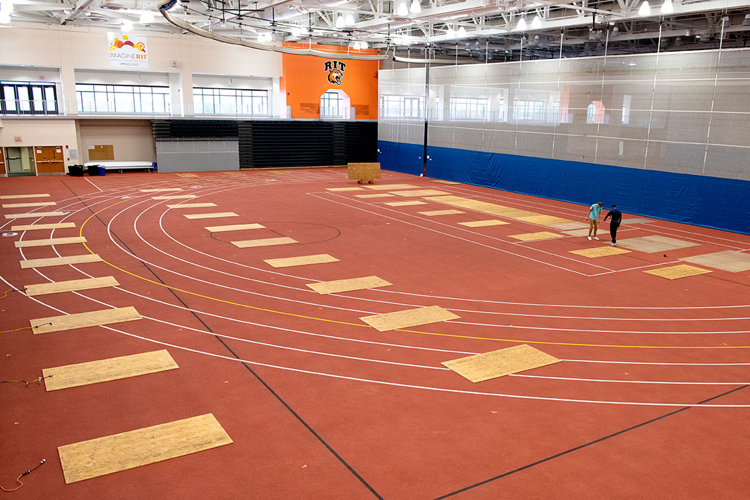 field house with several mats spaced out on the floor.