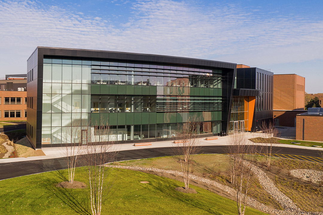 exterior of rounded glass building.