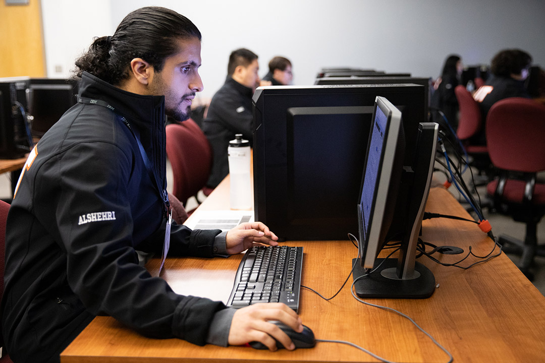 student using a desktop computer.