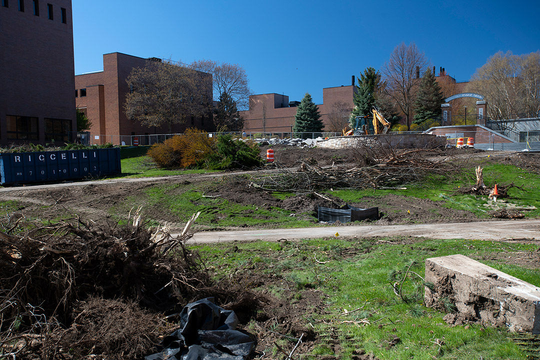 torn up grass and walkways for a construction project.