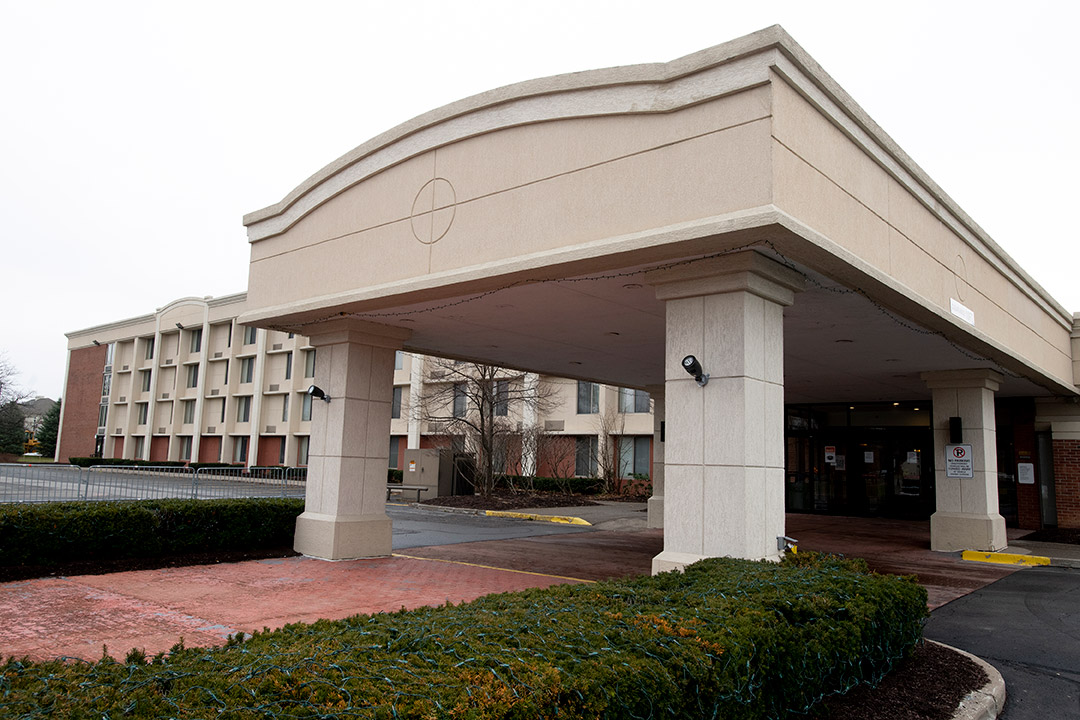 entryway overhang of a hotel building.