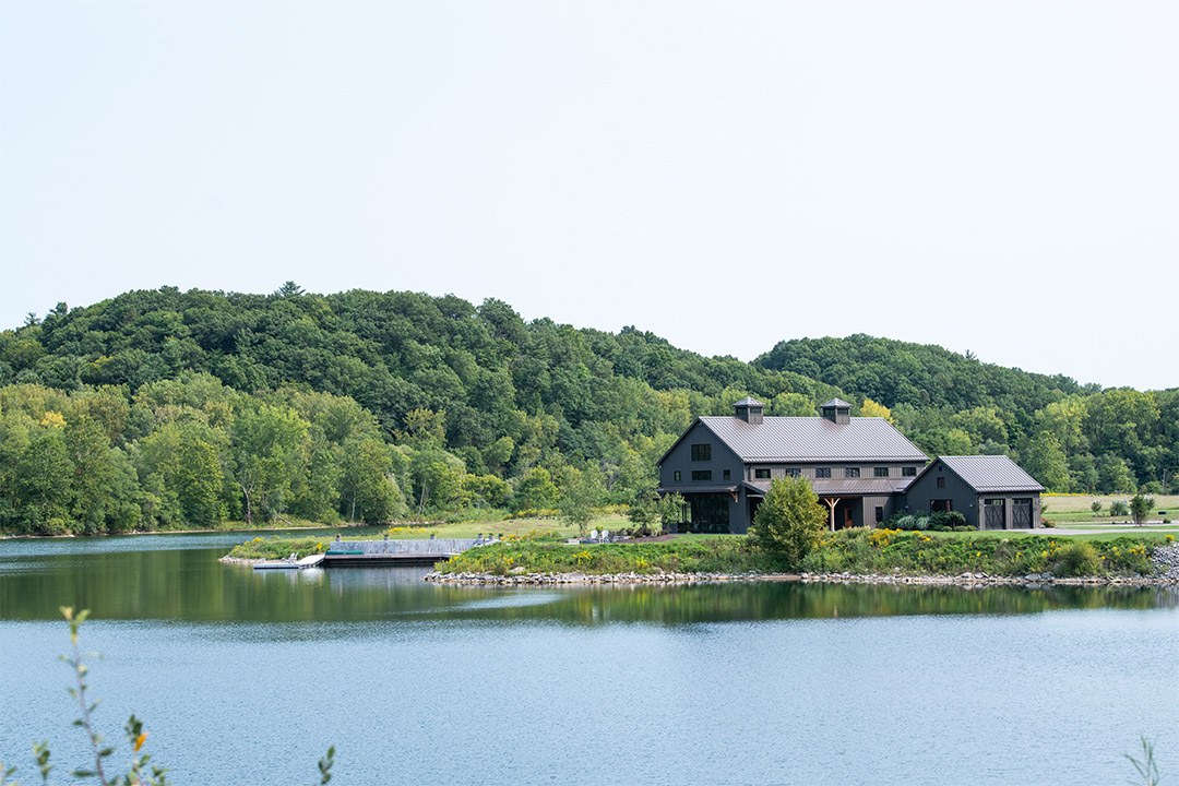 large house near a lake.