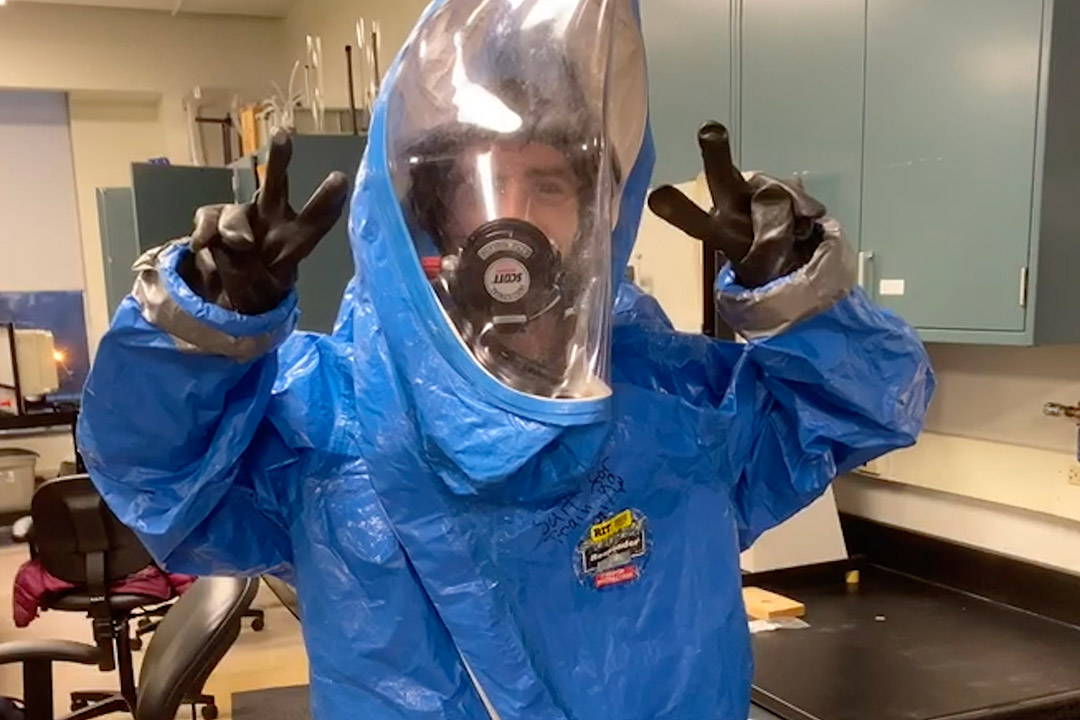 student wearing full protective gear for hazardous waste.