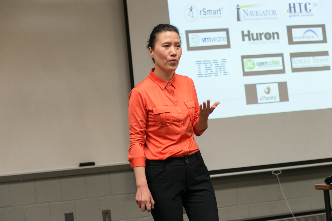 A Saunders professor teaches her class in a learning hall.