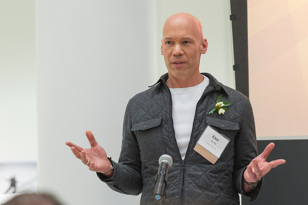 Eric Avar speaking at a podium.