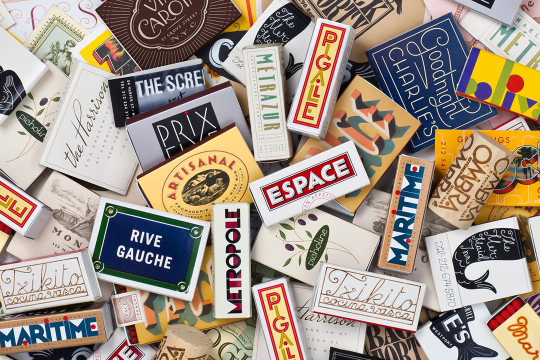 several matchbooks with varying designs and fonts.