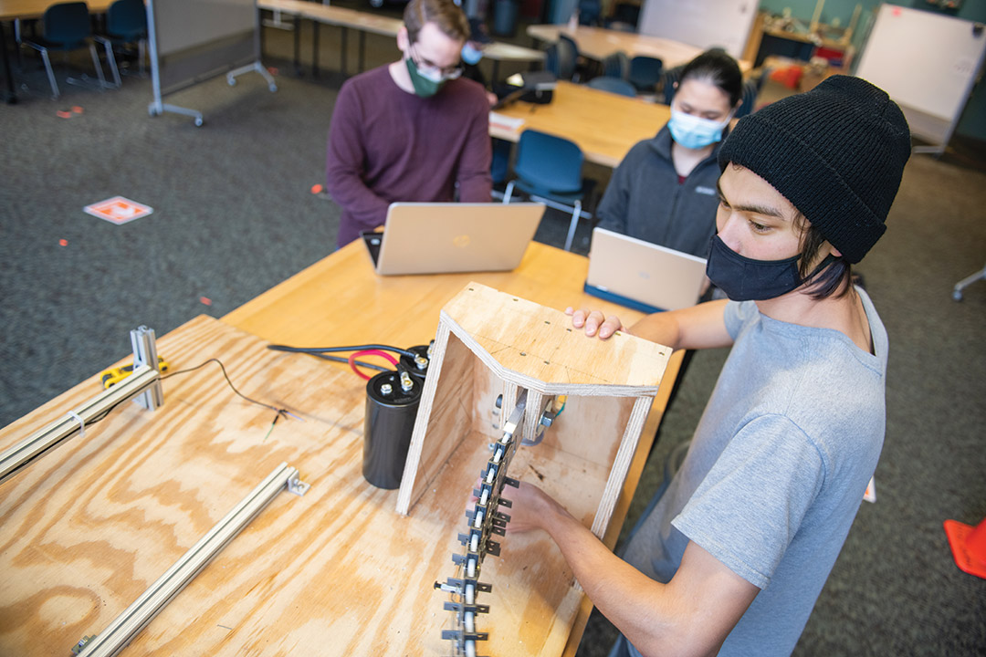 students working on robotic tail project.