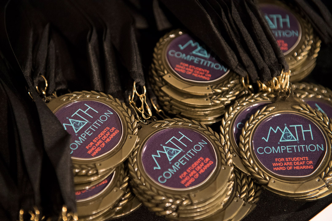 collection of math competition medals.