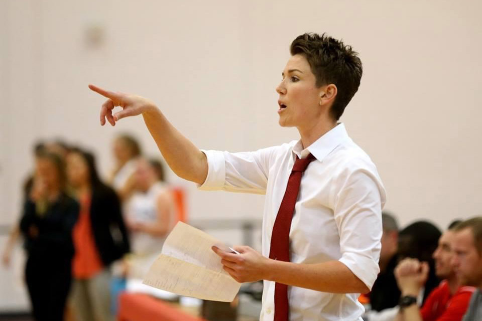 women's basketball coach calling out a play.