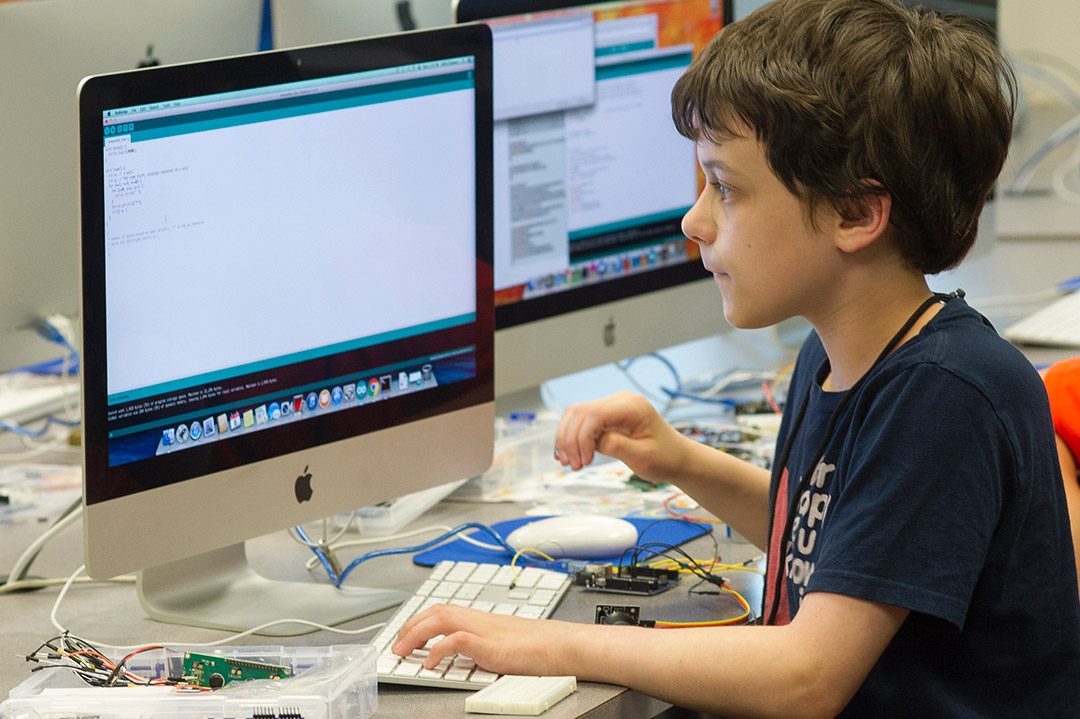 child working on a computer.