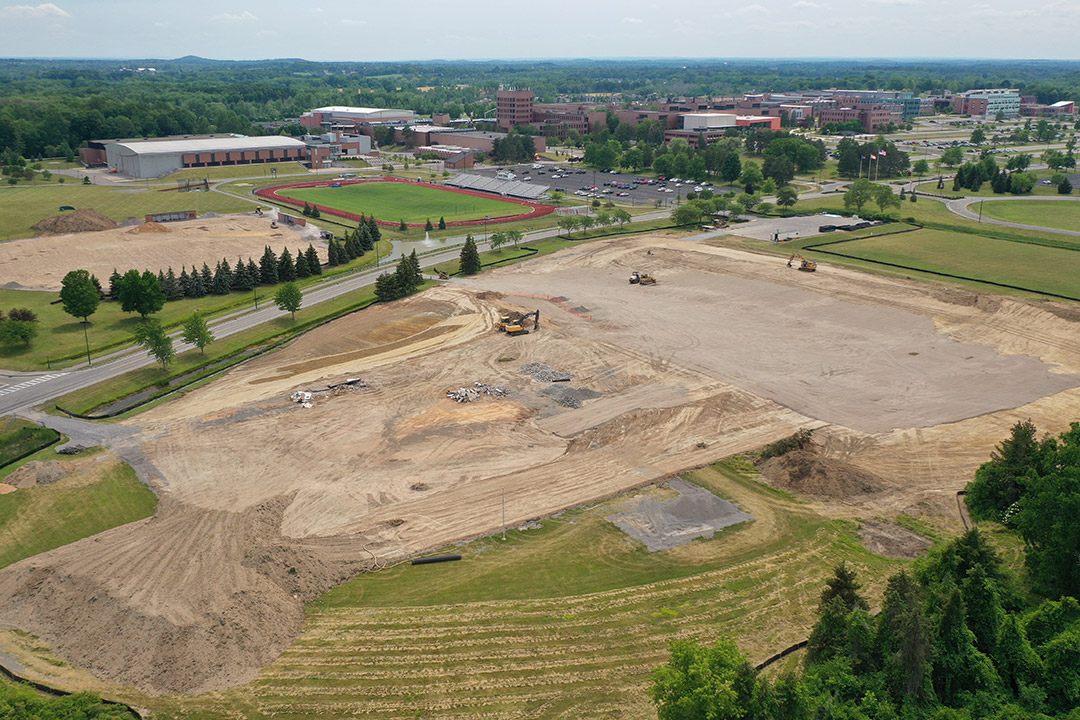 aerial view of construction of a track and baseball complex.