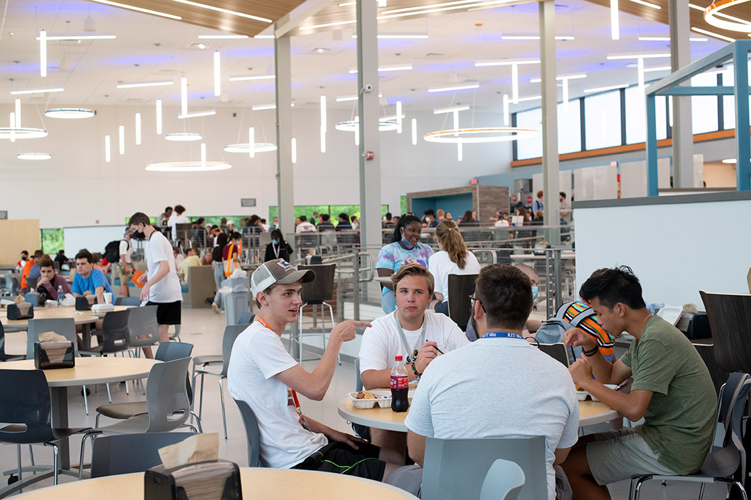 students eating in a renovated dining hall.