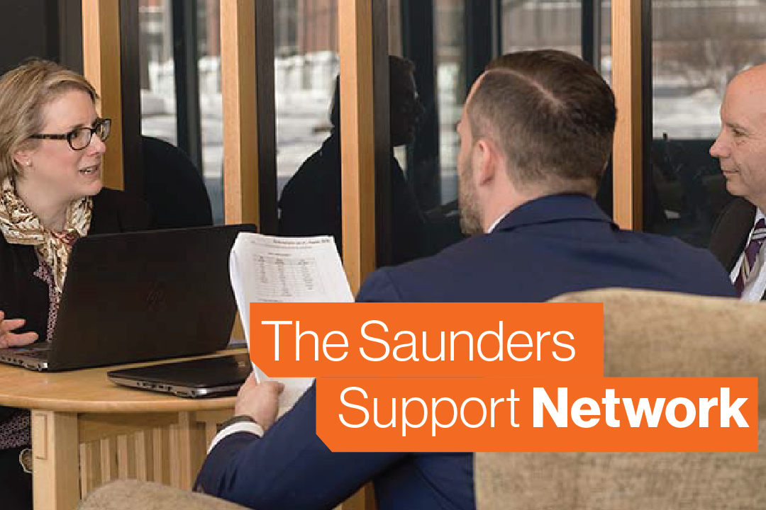 Saunders professionals interact in a business environment